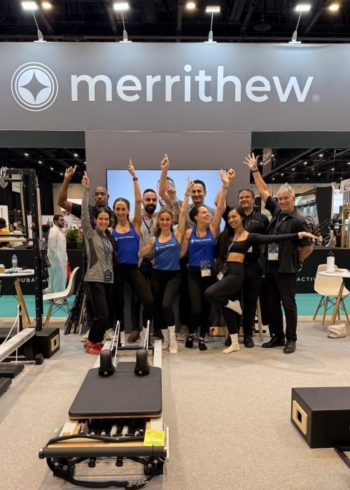 Louise with Pilates colleagues at a studio event